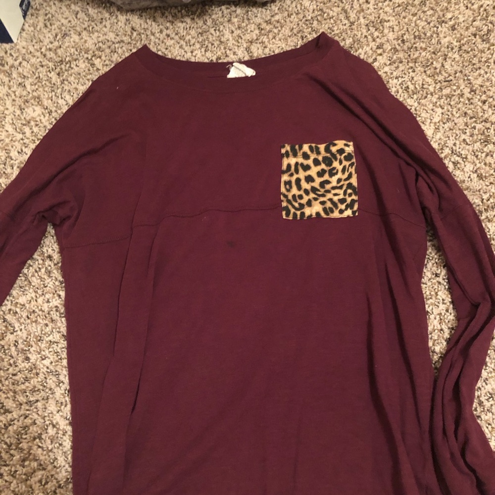 maroon longsleeve shirt with cheetah print pocket